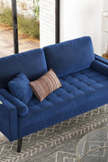 69.7-inch modern velvet sofa in navy blue with tufted back

Gray velvet upholstered sofa with pillows

Side view of modern green couch with wooden legs

Mid-century couch with tufted back and square arms