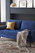 69.7-inch modern velvet sofa in navy blue with tufted back

Gray velvet upholstered sofa with pillows

Side view of modern green couch with wooden legs

Mid-century couch with tufted back and square arms