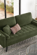 69.7-inch modern velvet sofa in navy blue with tufted back

Gray velvet upholstered sofa with pillows

Side view of modern green couch with wooden legs

Mid-century couch with tufted back and square arms