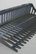 Heavy-duty skid steer skeleton rock bucket – front angled view

Close-up of reinforced steel tines and grapple mounts

84” rock bucket on skid steer in yard cleanup

Side view of skeleton-style skid loader bucket

Multiple bucket sizes displayed on gravel lot