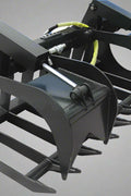 72" skid steer grapple bucket front view

84" rock grapple on skid steer in action

Close-up of dual hydraulic cylinder and hose setup

Heavy-duty tines and steel frame

Grapple holding large rocks and debris

