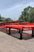 Heavy-duty loading dock ramp with red grating on asphalt yard

Forklift-compatible yard ramp side view with guardrails

Industrial dock ramp base plate and wheels

Side profile of 8 ft wide portable dock ramp

Ramp surface with serrated anti-slip steel close-up