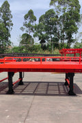 Heavy-duty loading dock ramp with red grating on asphalt yard

Forklift-compatible yard ramp side view with guardrails

Industrial dock ramp base plate and wheels

Side profile of 8 ft wide portable dock ramp

Ramp surface with serrated anti-slip steel close-up