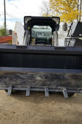 80" skid steer digging bucket with removable teeth

Heavy-duty bucket on job site with loader

Front view of 84-inch skid steer bucket

Skid steer digging into dirt with steel bucket

Wear strips and teeth close-up for material handling