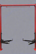 Red 2-post car hoist installed in garage

Close-up of safety lock and lift arms

Base of the lift showing manual release system

Top bar and symmetrical arm configuration