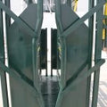 Front view of livestock squeeze chute with headgate
Side access cattle chute with secure latching panels
Cattle chute showing anti-slip flooring
Galvanized steel construction on the squeeze chute
Cattle chute in an outdoor ranch environment
Manual headgate opening on the chute