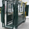 Front view of livestock squeeze chute with headgate
Side access cattle chute with secure latching panels
Cattle chute showing anti-slip flooring
Galvanized steel construction on the squeeze chute
Cattle chute in an outdoor ranch environment
Manual headgate opening on the chute