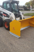 Bendall skid steer snow pusher attached to loader

Yellow snow box blade for skid steer

Heavy-duty snow bucket blade in winter setting

96-inch Bendall box blade in commercial snow use

Rear angle of Bendall snow blade showing mold board

