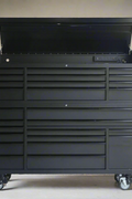 Top drawers of black tool chest with steel finish

