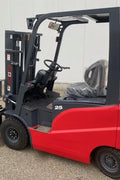 CanLift 5,500 lb electric forklift front side view

Side profile of electric forklift with red cabin

CanLift warehouse forklift with 4-foot lift

Battery-powered forklift in industrial setting

Forklift with cabin and side shift attachment