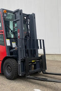 CanLift 5,500 lb electric forklift front side view

Side profile of electric forklift with red cabin

CanLift warehouse forklift with 4-foot lift

Battery-powered forklift in industrial setting

Forklift with cabin and side shift attachment