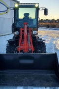 CanLift W12 Mini Wheel Loader with Kohler diesel engine outside a facility
Side view of CanLift W12 loader equipped with bucket attachment
Compact CanLift W12 Wheel Loader used on farm site