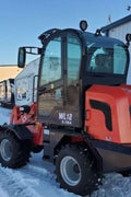 CanLift W12 Mini Wheel Loader with Kohler diesel engine outside a facility
Side view of CanLift W12 loader equipped with bucket attachment
Compact CanLift W12 Wheel Loader used on farm site