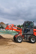 CanLift W12 Mini Wheel Loader with Kohler diesel engine outside a facility
Side view of CanLift W12 loader equipped with bucket attachment
Compact CanLift W12 Wheel Loader used on farm site