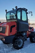 CanLift W12 Mini Wheel Loader with Kohler diesel engine outside a facility
Side view of CanLift W12 loader equipped with bucket attachment
Compact CanLift W12 Wheel Loader used on farm site