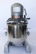 15 QT commercial dough mixer on stainless steel counter

Stainless steel mixing bowl with guard closed

Front view of food-grade commercial mixer with attachments

Dough hook installed on industrial kitchen mixer