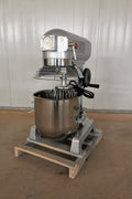 15 QT commercial dough mixer on stainless steel counter

Stainless steel mixing bowl with guard closed

Front view of food-grade commercial mixer with attachments

Dough hook installed on industrial kitchen mixer