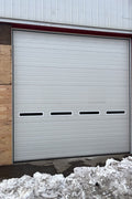 White insulated electric overhead garage door installed in shop
Heavy-duty motorized overhead garage door with steel frame
Electric garage door kit with insulation for industrial buildings
Overhead sectional garage door installed on warehouse