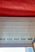 White insulated electric overhead garage door installed in shop
Heavy-duty motorized overhead garage door with steel frame
Electric garage door kit with insulation for industrial buildings
Overhead sectional garage door installed on warehouse