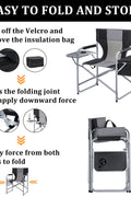 Heavy-duty folding camping chair with side table
Black outdoor director’s chair with cooler bag
Close-up of built-in cup holder and folding frame
Portable folding chair folded and packed for storage
Camping chair in use outdoors near a tent and a cooler