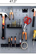 Heavy-duty metal pegboard set with 3 panels and 22 tool holders for garage or workshop wall organization
