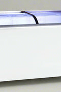 Glass top commercial chest freezer front view
Curved glass sliding lids with locking mechanism
Interior with baskets and LED lighting
Bottom wheels and caster locks
Full-body side angle in white finish