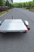Heavy-duty galvanized 4x8 folding utility trailer with checker plate deck and road-ready tires