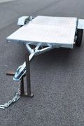 Heavy-duty galvanized 4x8 folding utility trailer with checker plate deck and road-ready tires