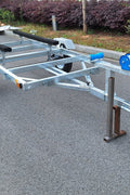 Heavy-duty galvanized 4x8 folding utility trailer with checker plate deck and road-ready tires