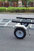 Heavy-duty galvanized 4x8 folding utility trailer with checker plate deck and road-ready tires