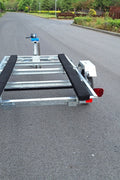 Heavy-duty galvanized 4x8 folding utility trailer with checker plate deck and road-ready tires