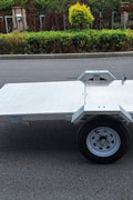 Heavy-duty galvanized 4x8 folding utility trailer with checker plate deck and road-ready tires