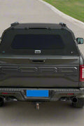 Side view of heavy-duty steel truck topper on black pickup
Modular canopy with open gullwing side door
Lockable utility cap rear view
Installation components of modular truck canopy
Steel topper installed on full-size pickup truck
