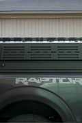 Side view of heavy-duty steel truck topper on black pickup
Modular canopy with open gullwing side door
Lockable utility cap rear view
Installation components of modular truck canopy
Steel topper installed on full-size pickup truck