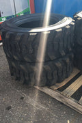 “Heavy duty skid steer tires with aggressive tread”

“SKS-1 and SKS-4 tires for Bobcat A300 and S750”

“Skid steer tires with red and silver rims”

“10x16.5 to 15x19.5 skid steer tire variants”

“Close-up of durable construction skid steer tire”

