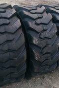 “Heavy duty skid steer tires with aggressive tread”

“SKS-1 and SKS-4 tires for Bobcat A300 and S750”

“Skid steer tires with red and silver rims”

“10x16.5 to 15x19.5 skid steer tire variants”

“Close-up of durable construction skid steer tire”

