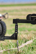 Barbed wire unroller mounted on a hitch
Fence wire roller with ATV adapter
Heavy-duty barbed wire dispenser close-up
Side profile of wire unroller