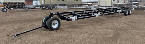 Industries America 441 Header Trailer – Side View with Bunks

41 FT Header Transport Trailer – Tandem Axle Design

Black Agricultural Header Trailer – Top Angle

Header Hauling Trailer with Adjustable Support Arms

Industrial 41 FT Trailer for Agricultural Equipment Transport