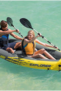 Intex Explorer K2 inflatable kayak on water with paddles

Top view of Explorer K2 kayak with seats and pump

Close-up of inflatable cockpit seats

Full kayak set with oars, pump, and skeg

Explorer K2 in yellow – packaged with accessories