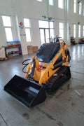 “T380 compact skid steer loader with rubber tracks”

“T460 mini tracked loader for landscaping and excavation”

“Heavy-duty skid steer with universal quick attach plate”

“Tracked compact construction loader in yellow”