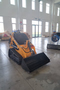“T380 compact skid steer loader with rubber tracks”

“T460 mini tracked loader for landscaping and excavation”

“Heavy-duty skid steer with universal quick attach plate”

“Tracked compact construction loader in yellow”
