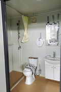 Gray single toilet portable restroom trailer
Double stall mobile toilet unit for construction use
Interior view of portable washroom with sink
Mobile shower unit with privacy enclosure
Pre-installed fixtures inside portable toilet and shower model
