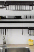 Black stainless steel over-the-sink dish drying rack with hooks and shelves