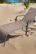 Reclining folding patio lounger chair on the beach

Adjustable sun lounger with breathable Teslin mesh

Close-up of outdoor lounger armrest and frame

Folded outdoor lounge chair ready for storage

Lounger chair beside swimming pool deck