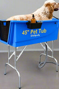 Golden retriever sitting in blue dog grooming tub
Foldable stainless steel leg wash station for dogs
Dog standing in grooming bathtub
Plastic tub with stainless legs folded for storage
Close-up view of tub interior and drainage area