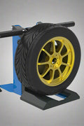 Portable pneumatic tire lift for 150 lb wheels

Side view of tire lifting tool with foot pedal

Adjustable height wheel lift tool for garages

Tire shop equipment with pneumatic assist

Red and black tire wheel lifter for mechanics