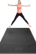 woman exercising on black non-slip fitness mat at home

large gorilla mat for home gym with yoga straps

extra thick workout mat for HIIT and cardio training

folded 7mm thick gym mat with carry handle

yoga and strength training on extra-large exercise mat