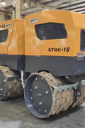 Front View of STORIKE 1114418 Remote-Controlled Trench Roller

Remote Control Device for Trench Roller Compactor

Side View of Heavy-Duty Soil Compactor Roller

STORIKE Trench Roller in Industrial Setting

Rear Angle of Remote-Controlled Soil Compactor