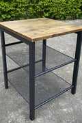 Rustic end tables in a cozy living room setting with sofa and lamp

Side View: Square wood top table with black mesh shelf

Angled View: Rustic wood and black metal table with adjustable shelf

Front View: Front profile of industrial end table with wood top and mesh shelf

Top View: Close-up of wood grain tabletop with rounded edges