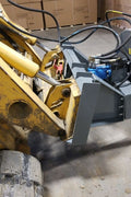BX42 wood chipper attachment side view
Front-facing view of skid steer wood chipper BX42
Close-up of BX42 hydraulic chute and rotor
Rear view showing input hopper and feed
Mounted BX42 chipper on skid steer